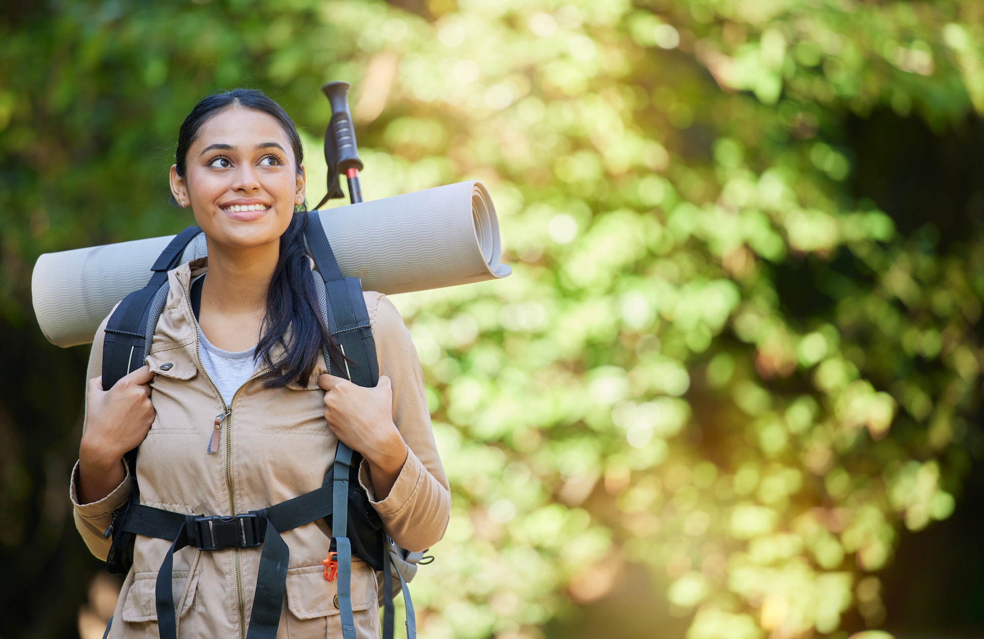 Woman, hiking and backpacking for spiritual adventure, trekking or camping in the nature outdoors.